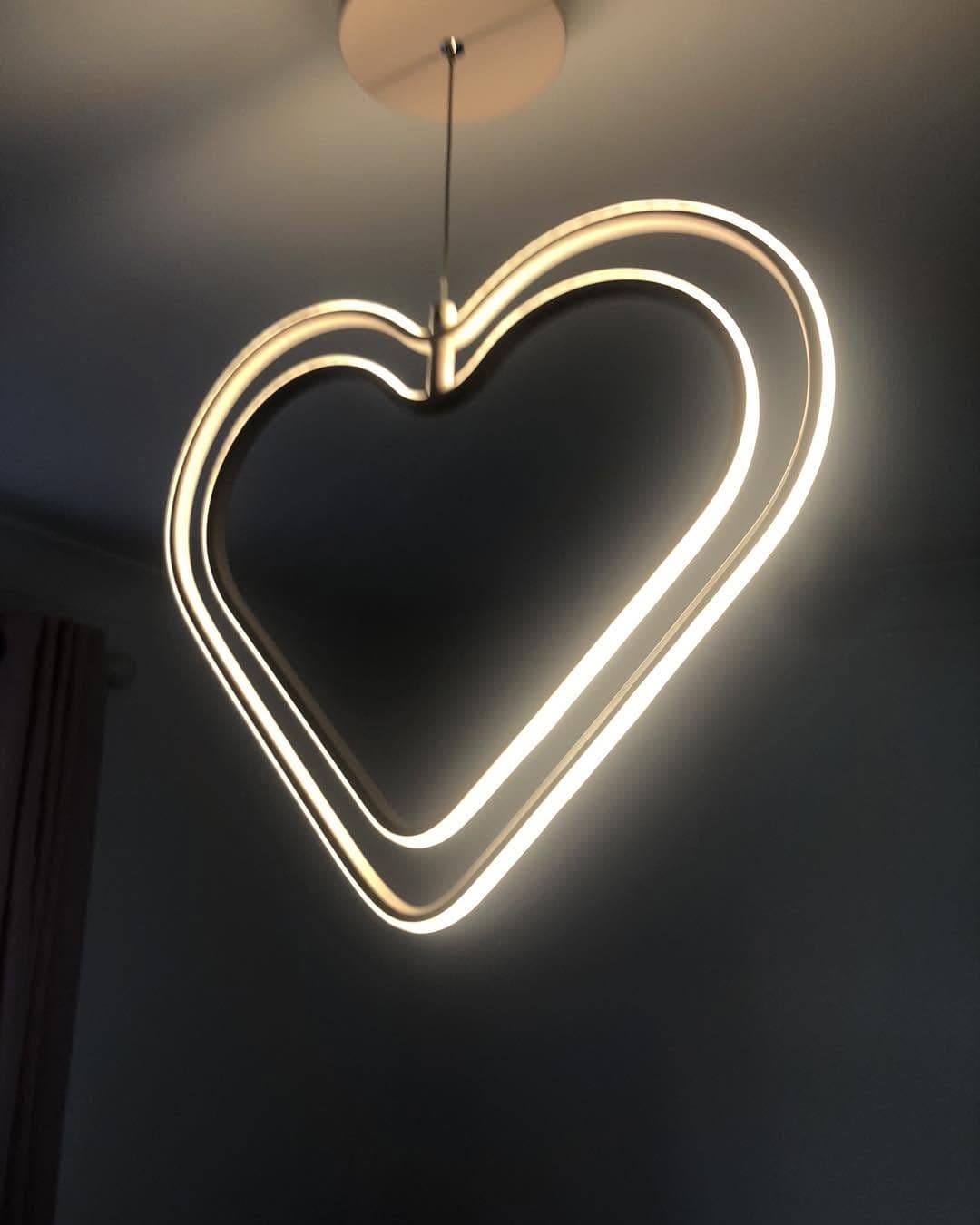 Adjustable track lighting on a vaulted timber ceiling